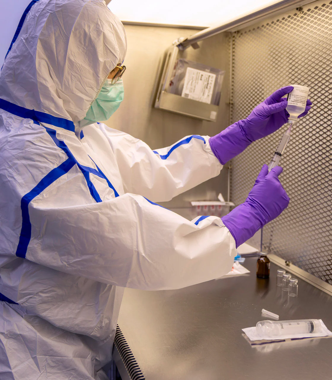 Pharmacist preparing a sterile compounded medication — placeholder, replace with TCC asset