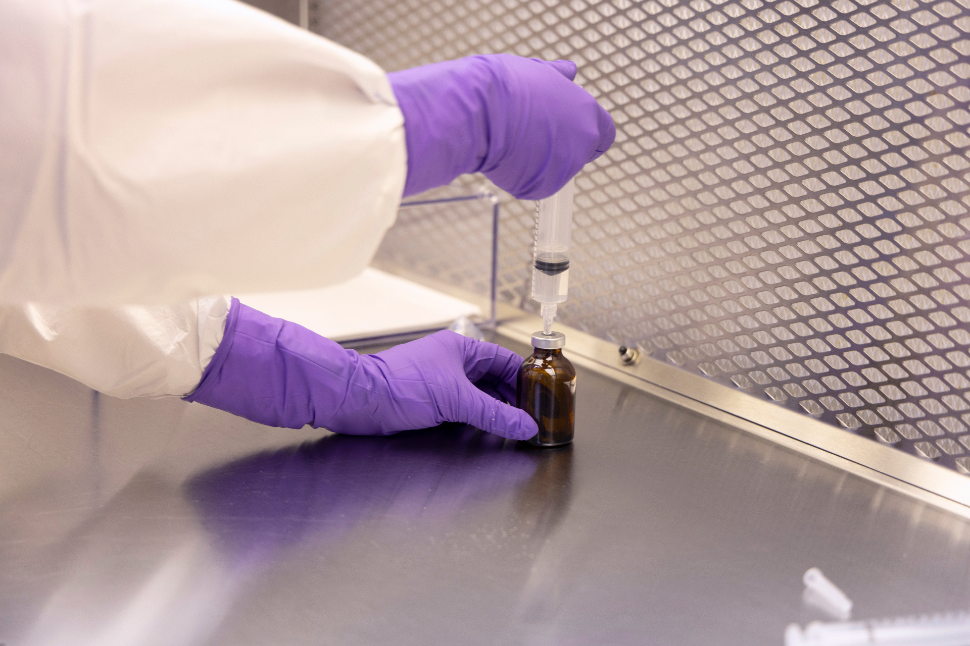 Sterile vial under controlled lab lighting — placeholder, replace with TCC asset